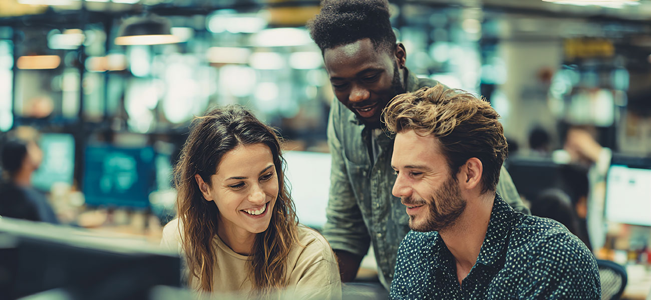 Team collaborating in an open office, reflecting coordinated AI agent orchestration